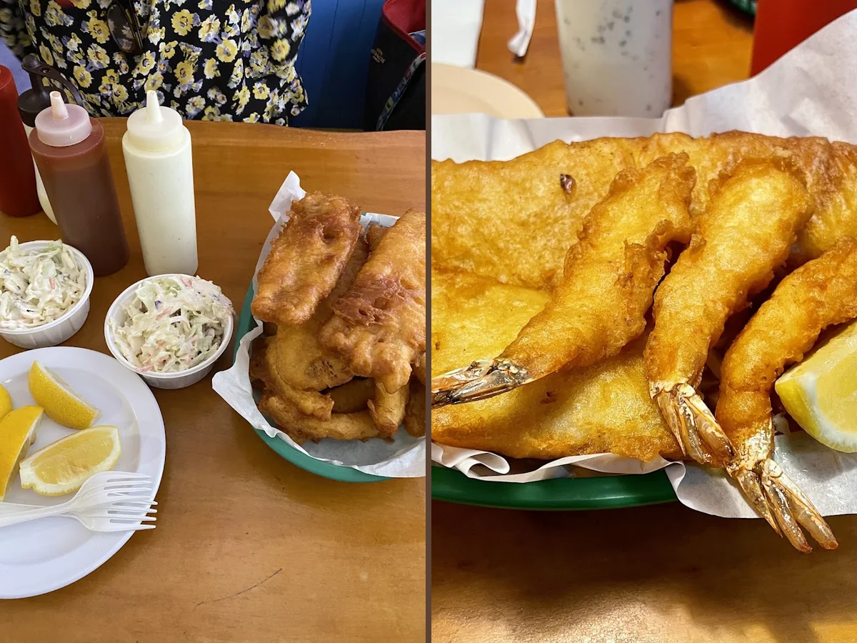 Golden fried fish and chips on a white plate.